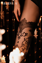 Standing close-up of Baroque 15D black floral embossed pantyhose