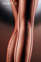 Back-seam close-up of Denpa 8D black glossy jacquard pantyhose