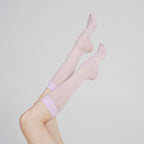 Raised legs wearing Graceline 8D lavender plaid knee-high socks