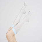 Upward pose in Graceline 8D light-blue plaid knee-high socks