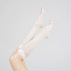 Raised legs wearing Graceline 8D white plaid knee-high socks