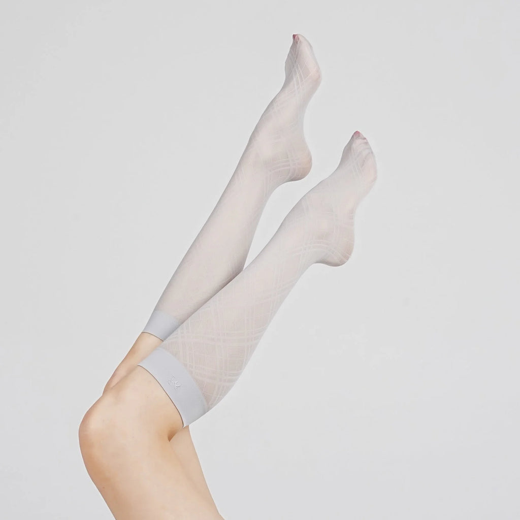 Product view of Graceline 8D light-blue plaid knee-high socks on raised legs