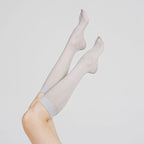 Product view of Graceline 8D light-blue plaid knee-high socks on raised legs