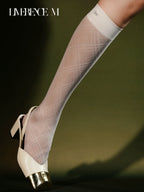 Graceline 8D white plaid knee-high socks styled with metallic heels