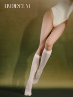 Standing pose in Graceline 8D white plaid knee-high socks