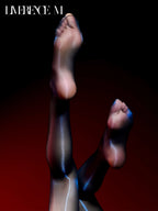 Raised legs wearing Prism 15D black high-shine pantyhose